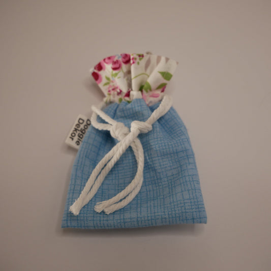 Dog poo bag roll holder in light blue bottom and floral white collar - Doggie Dekor