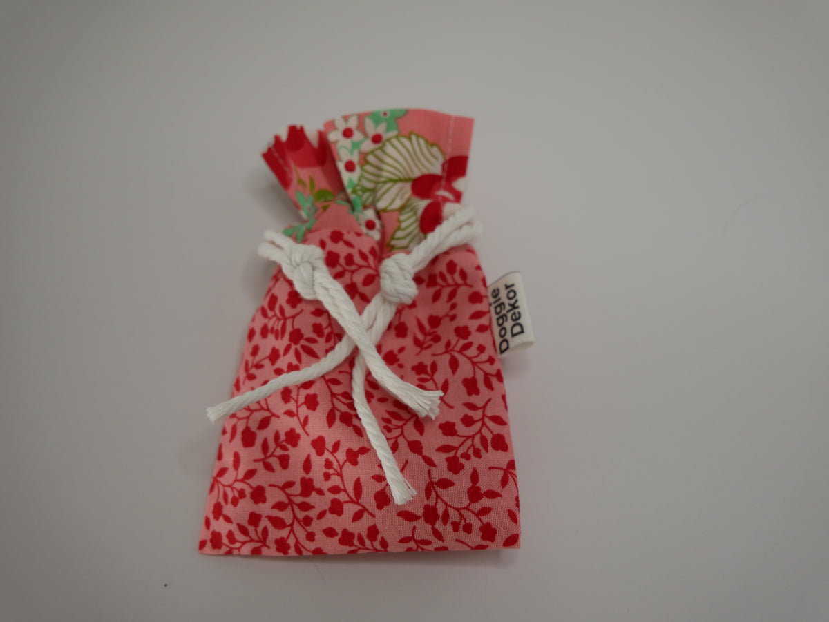 Dog poo bag roll holder in coral with a coral floral collar - Doggie Dekor