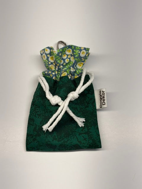 Dog poo bag holder - 100% cotton drawstring pouch in dark green with a lighter green floral patterned collar, white drawstring and metal clip - Doggie Dekor
