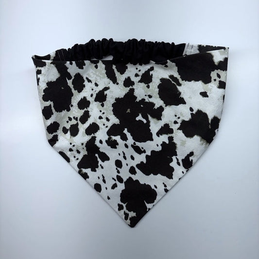 Scrunchie Bandana sewn in black and white cow print fabric on a white background