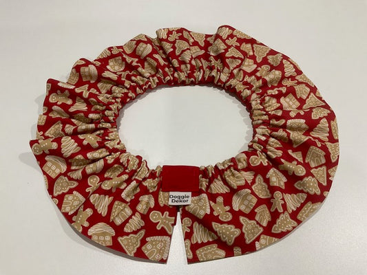 A dogs neck ruffle with a beige gingerbread-themed pattern, by doggie dekor calgary.