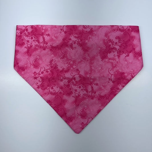 Pink floral patterned scrunchie bandana on a white background