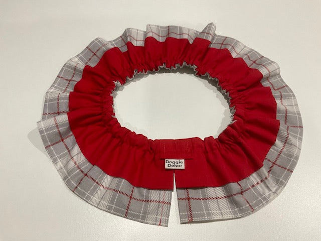 A red and gray plaid dog neck ruffle by Doggie Dekor, Calgary. 