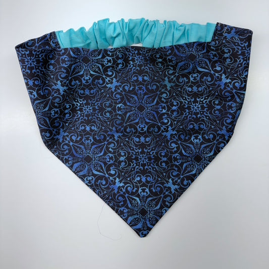 Blue patterned scrunchie bandana on a white background