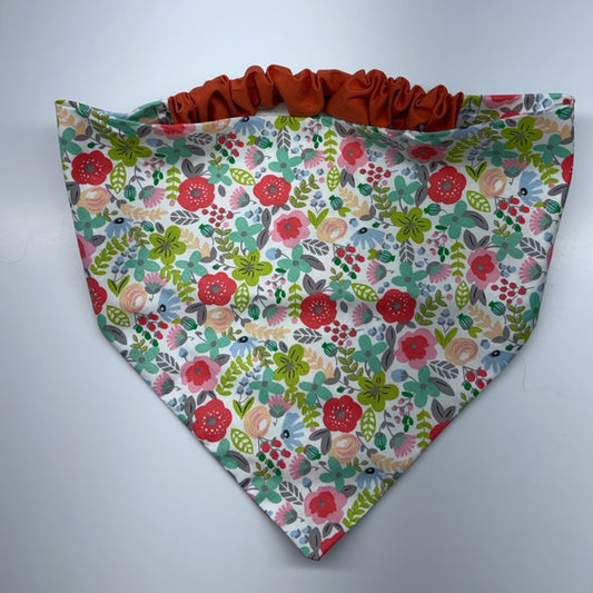 Floral patterned fabric with ruffled edge on a white background