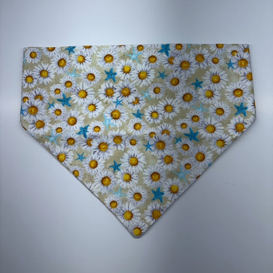 Floral patterned scrunchie bandana with daisies and blue starfish on a plain background